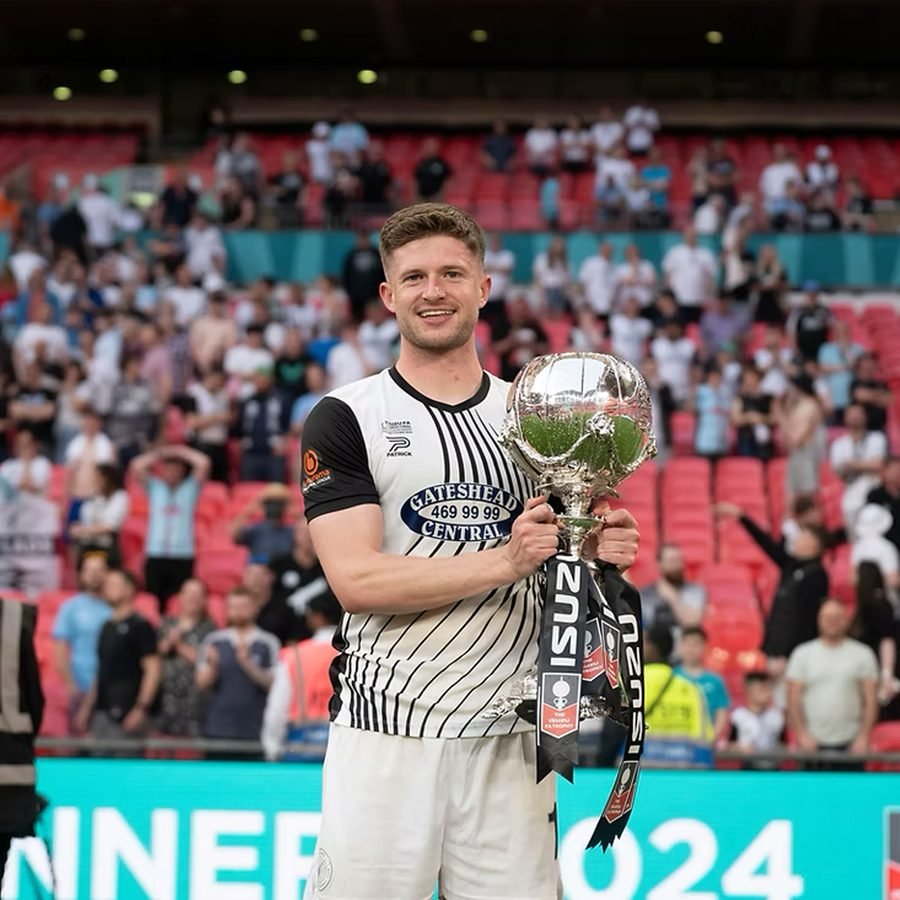 Joe Grayson holding the FA Trophy at Wembley after winning it with Gateshead
