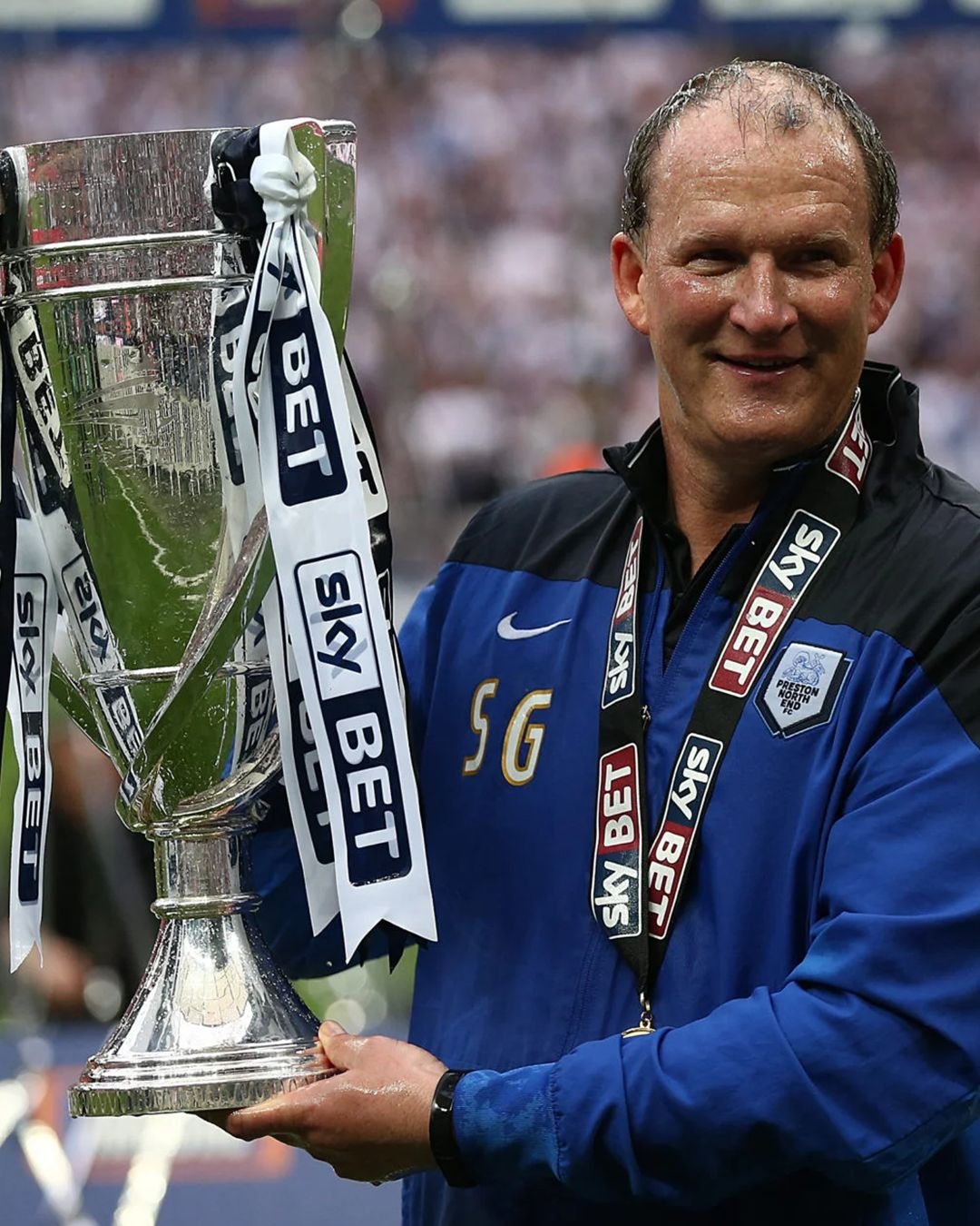 Simon Grayson holding the League One play-off trophy at Wembley in 2015 as Preston North End manager